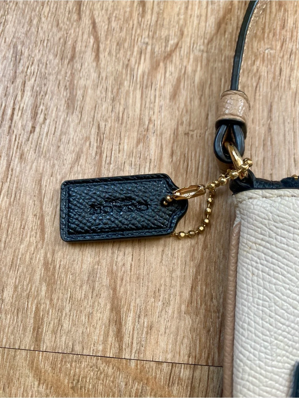 Coach Cream and Black Zip Wristlet
